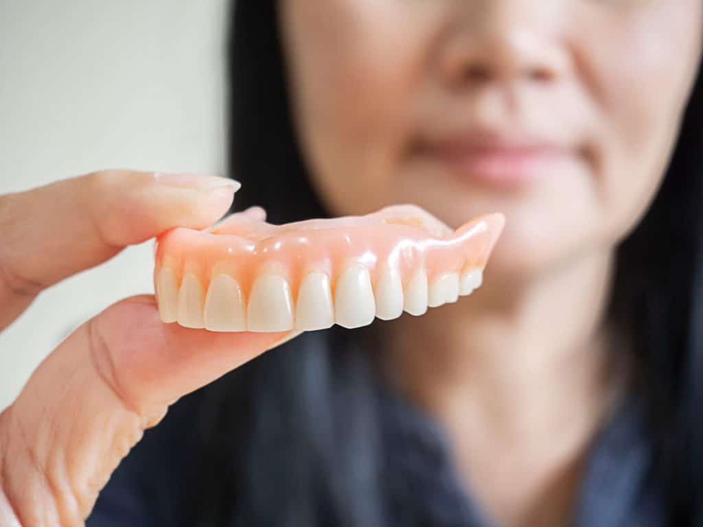 Dental Implants vs Dentures: Making the Right Choice